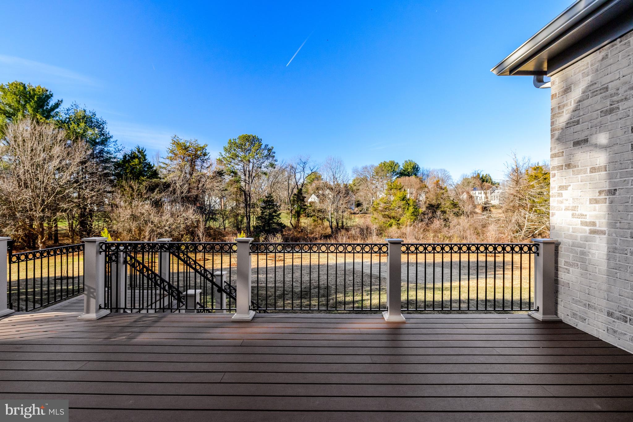 1002 Springvale Road Great Falls, VA 22066 - Photo 48 of 52 a view of a balcony with wooden floor and fence