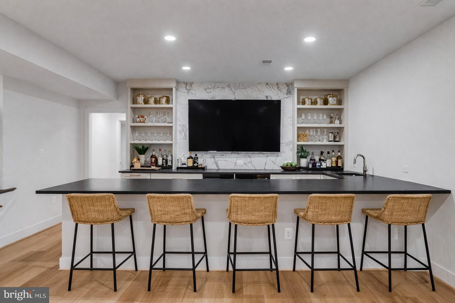 1002 Springvale Road Great Falls, VA 22066 - Photo 60 of 73 a kitchen with stainless steel appliances kitchen island granite countertop a dining table chairs and a refrigerator