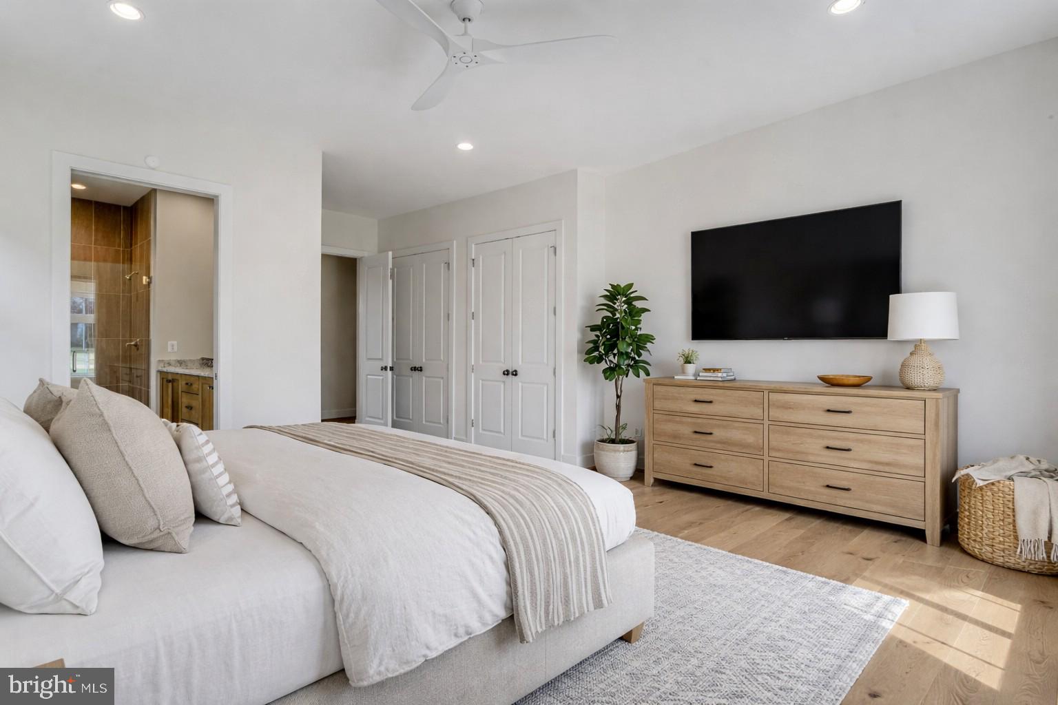 1002 Springvale Road Great Falls, VA 22066 - Photo 66 of 114 a bedroom with a bed and flat screen tv