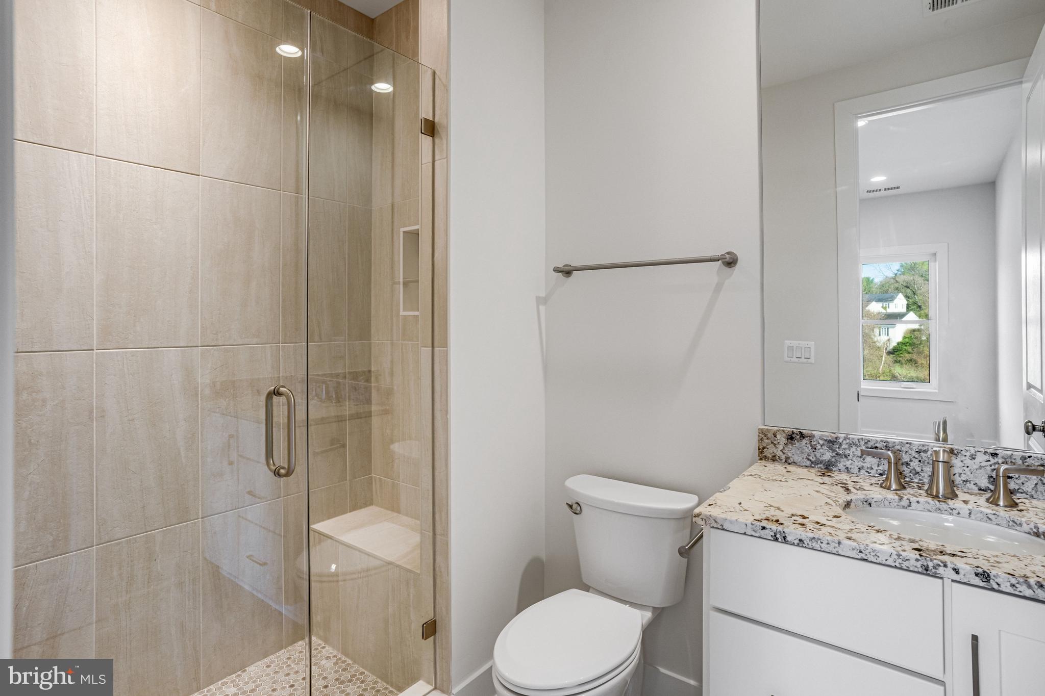 1002 Springvale Road Great Falls, VA 22066 - Photo 97 of 114 a bathroom with a granite countertop sink toilet and shower