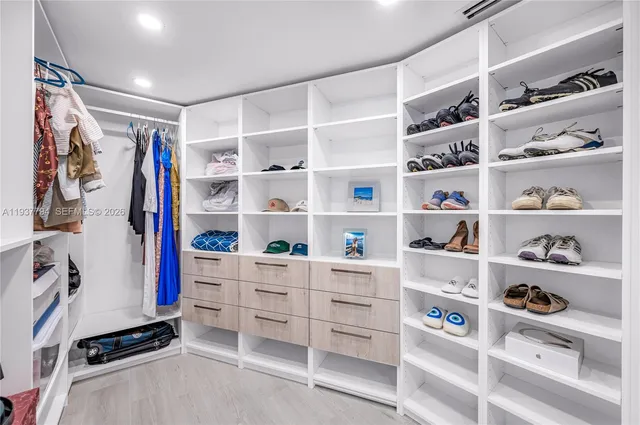 a view of walk in closet with shelves