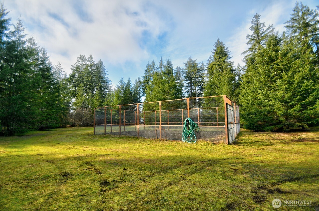 220 West Buck Prairie Road Elma, WA 98541 - Photo 26 of 30 a view of a swimming pool with a garden