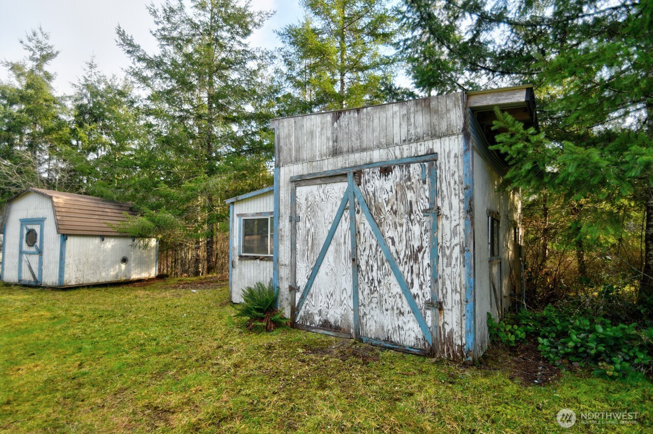 220 West Buck Prairie Road Elma, WA 98541 - Photo 29 of 30 a view of a backyard with a tree