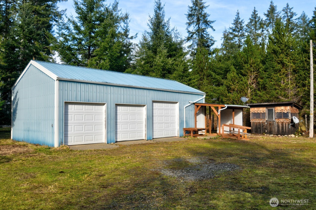 220 West Buck Prairie Road Elma, WA 98541 - Photo 3 of 30 a front view of house with yard and trees in the background