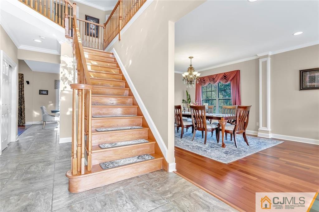 87 Willocks Circle Somerset, NJ 08873 - Photo 11 of 31 a view of entryway dining room and hall with wooden floor