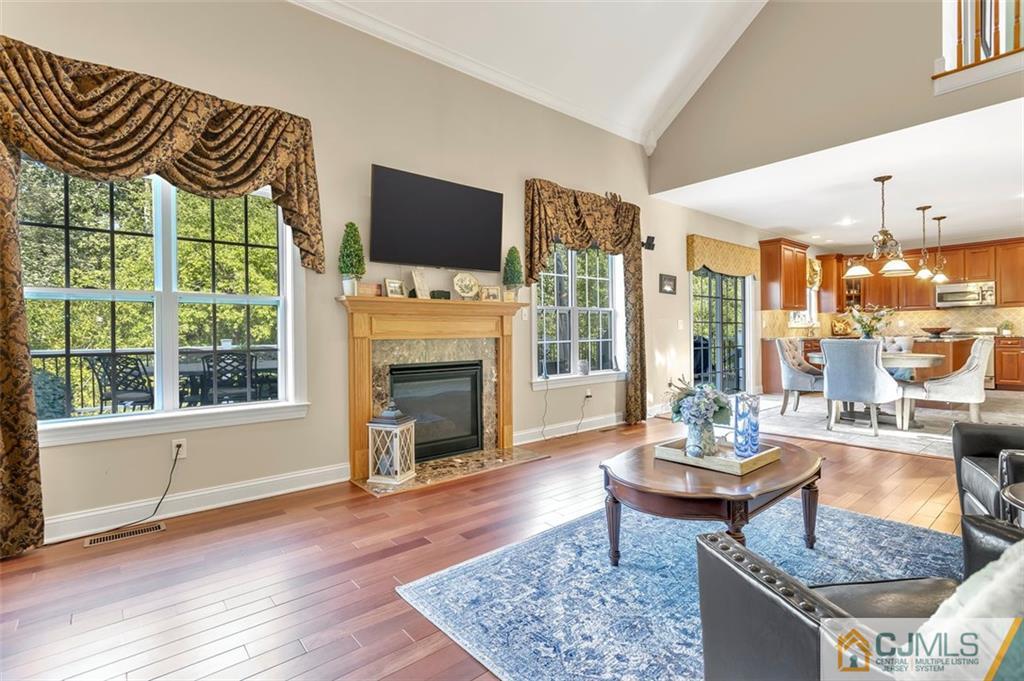 87 Willocks Circle Somerset, NJ 08873 - Photo 13 of 31 a living room with fireplace furniture and a flat screen tv