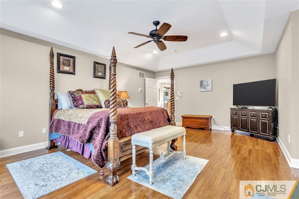 87 Willocks Circle Somerset, NJ 08873 - Photo 16 of 31 a bedroom with a bed and a flat screen tv