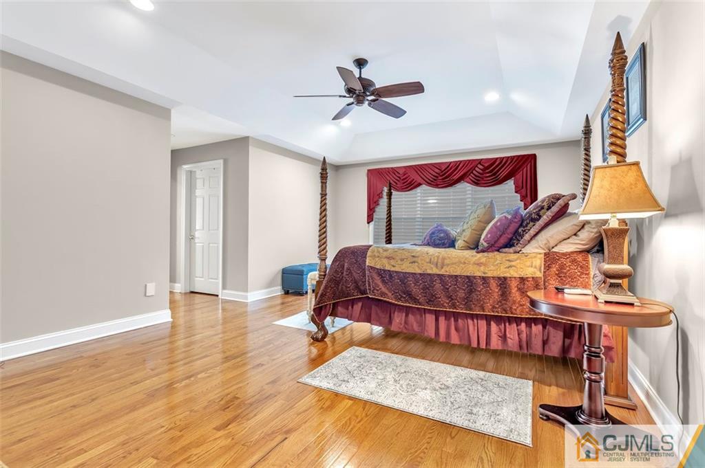 87 Willocks Circle Somerset, NJ 08873 - Photo 17 of 31 a bedroom with a bed and wooden floor