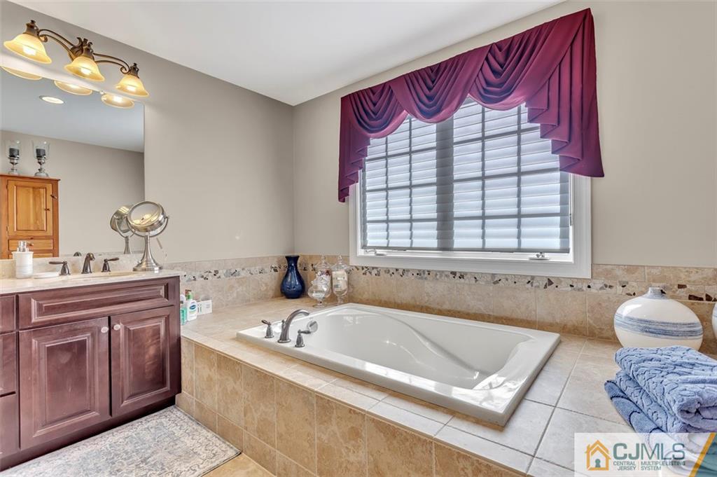 87 Willocks Circle Somerset, NJ 08873 - Photo 20 of 31 a bathroom with a bathtub and a sink