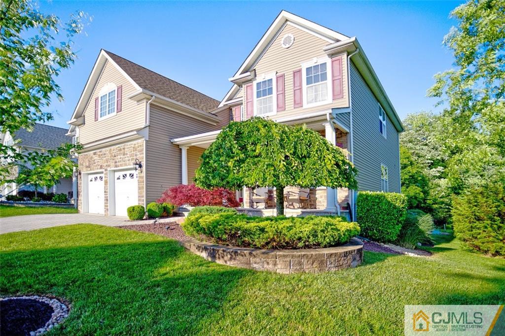 87 Willocks Circle Somerset, NJ 08873 - Photo 2 of 31 a front view of a house with a yard and trees