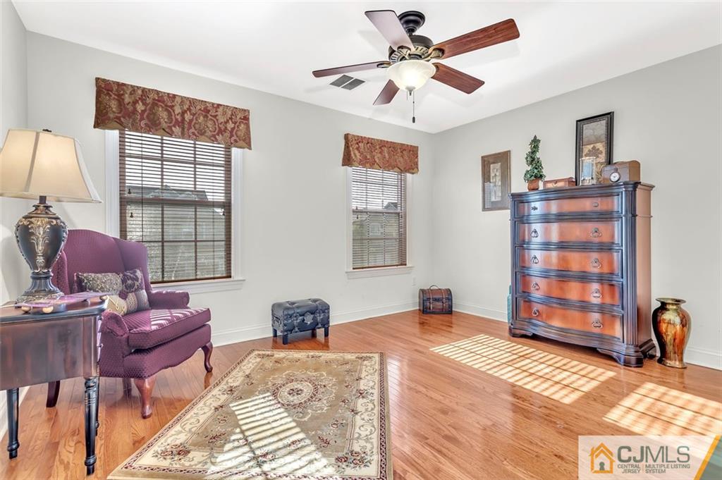 87 Willocks Circle Somerset, NJ 08873 - Photo 25 of 31 a bedroom with a bed dresser and a window