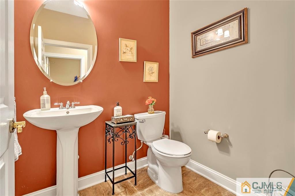 87 Willocks Circle Somerset, NJ 08873 - Photo 31 of 31 a bathroom with a sink mirror and toilet