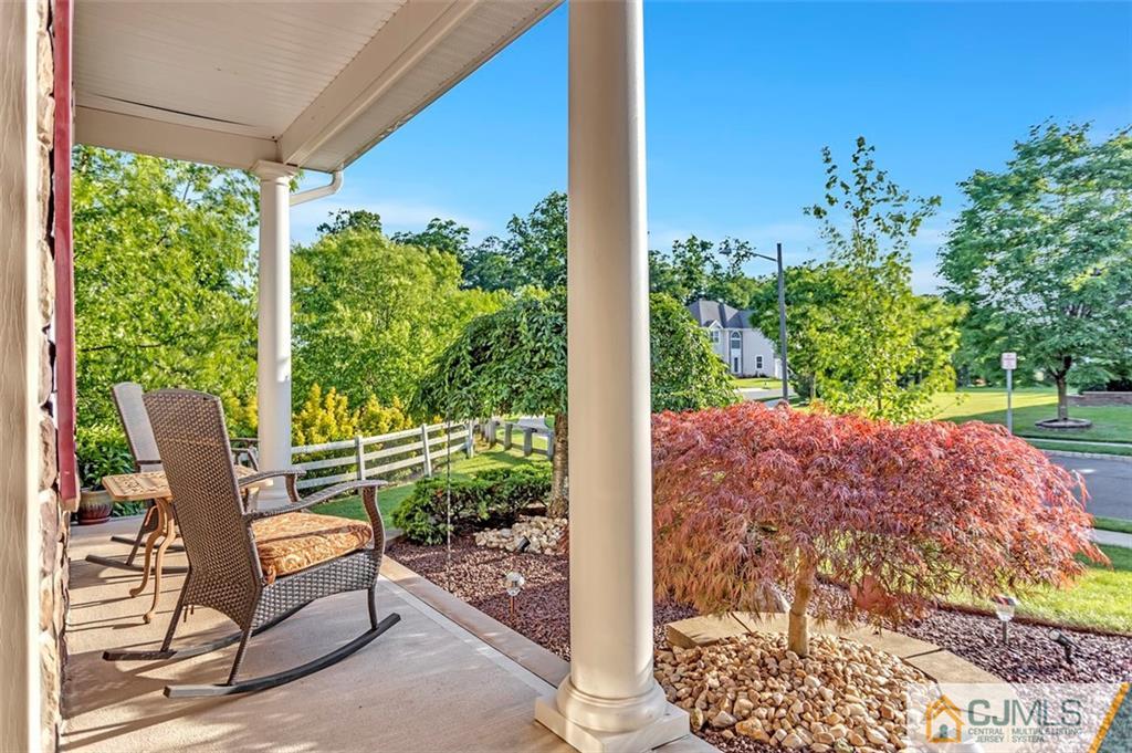 87 Willocks Circle Somerset, NJ 08873 - Photo 4 of 31 a view of a porch with furniture and garden