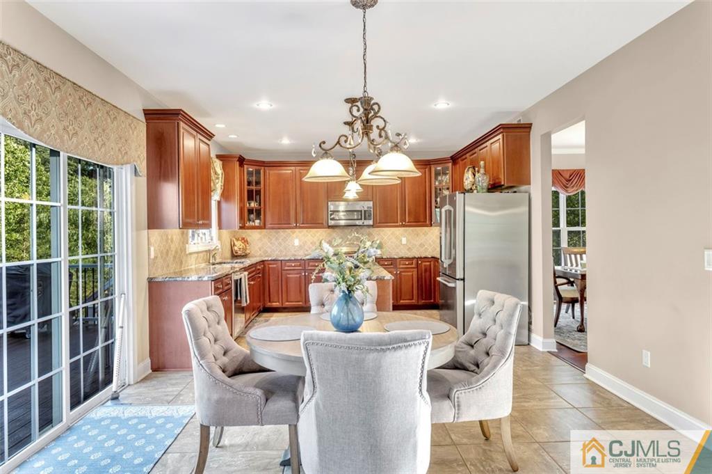 87 Willocks Circle Somerset, NJ 08873 - Photo 9 of 31 a view of a dining room with furniture window and outside view