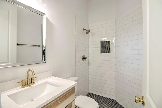 a kitchen that has a sink and a stove in it