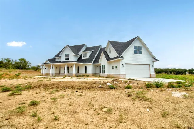 a front of a house with a yard