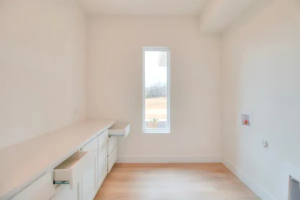a view of an empty room with a window