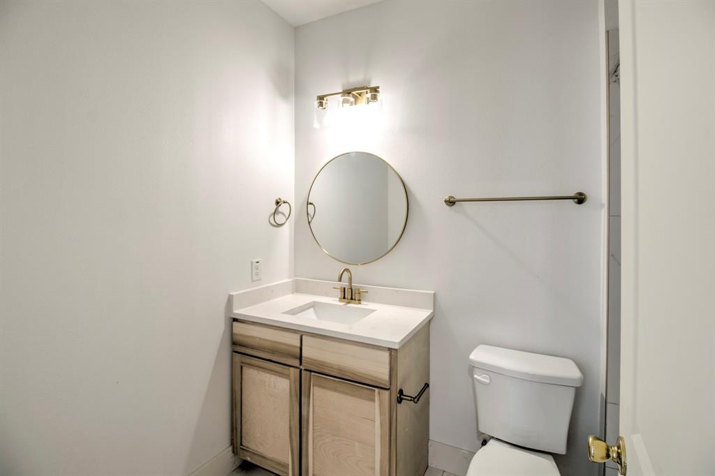 117 Mustang Springs Circle Sunset, TX 76270 - Photo 28 of 40 Bathroom featuring vanity and toilet