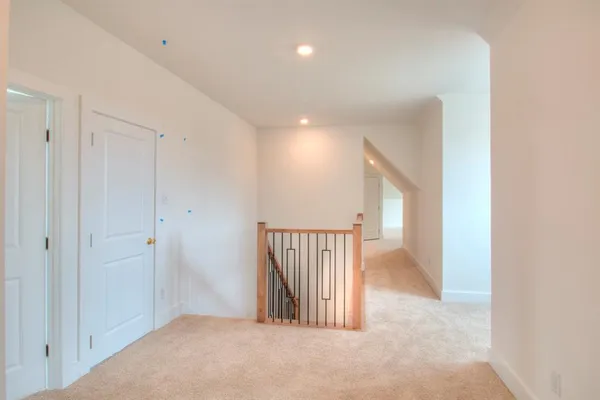 a view of a hallway with staircase