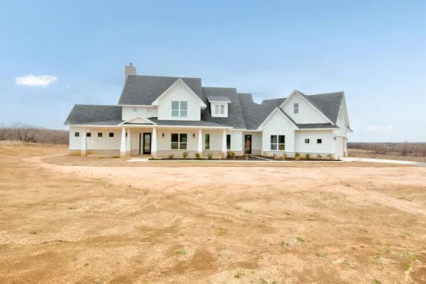 a big house with swimming pool in front of it