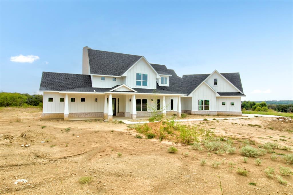 117 Mustang Springs Circle Sunset, TX 76270 - Photo 3 of 40 Modern inspired farmhouse with a porch, board and batten siding, and a shingled roof