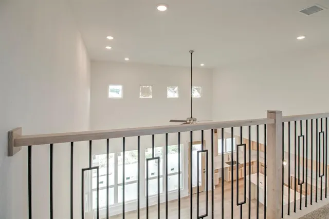 a view of a hallway with windows