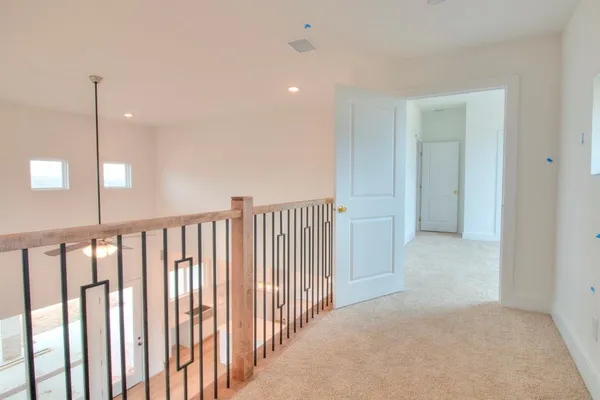 a view of a hallway with windows