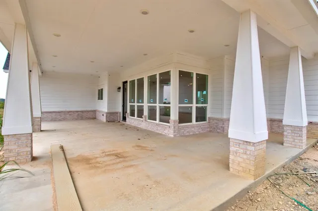 a view of an empty room with a balcony