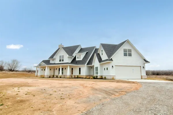 a house with a wooden fence