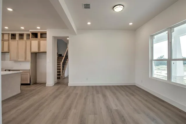a view of a kitchen with a sink and a window
