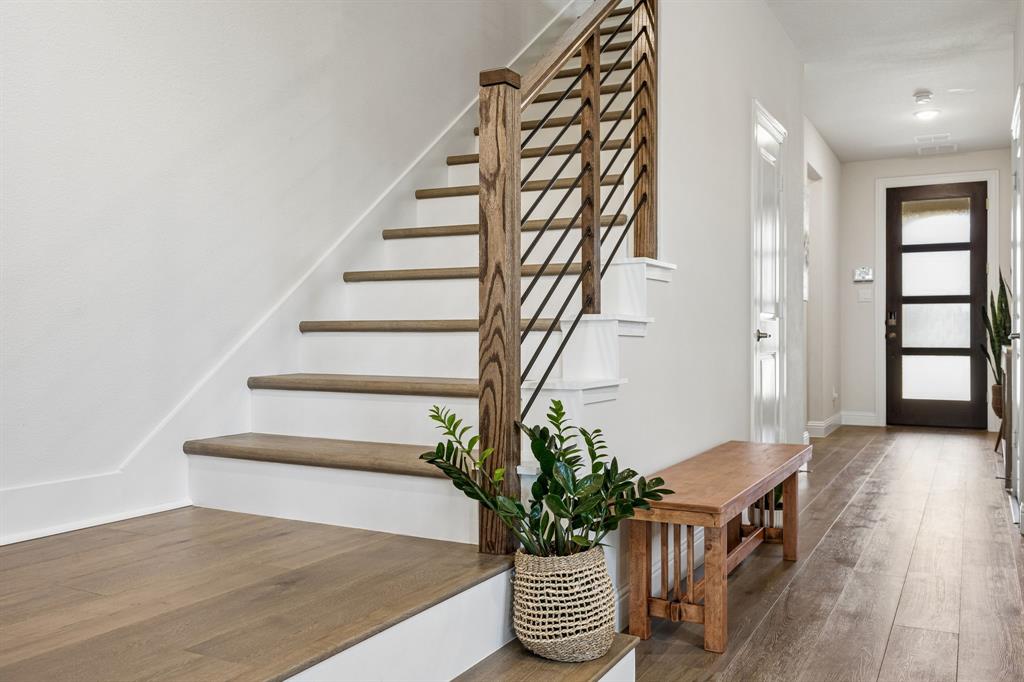 425 Breeds Hl Road Little Elm, TX 75068 - Photo 2 of 38 a view of entryway with wooden floor and stairs