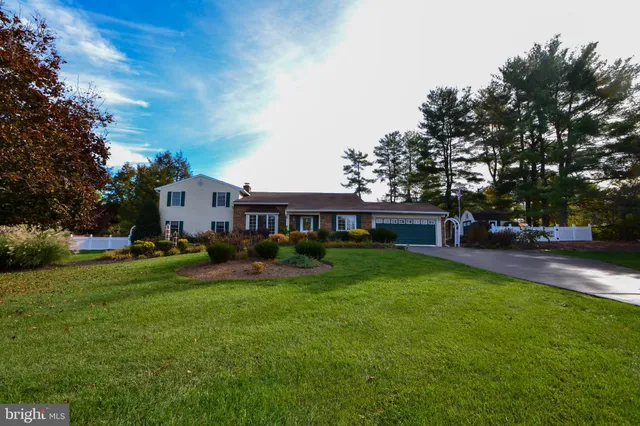 a view of house with outdoor space and yard