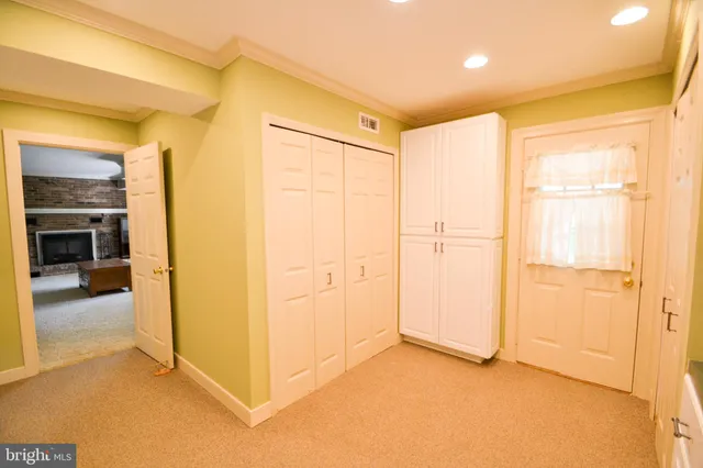 a view of a livingroom with a ceiling fan and window