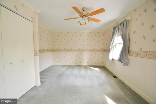 a bathroom with a toilet and shower