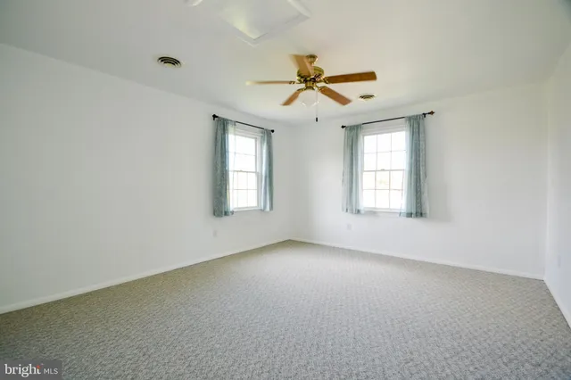 a kitchen with stainless steel appliances granite countertop a refrigerator a stove a sink and a microwave