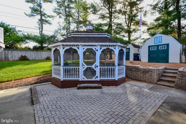 a view of a house with a porch and furniture