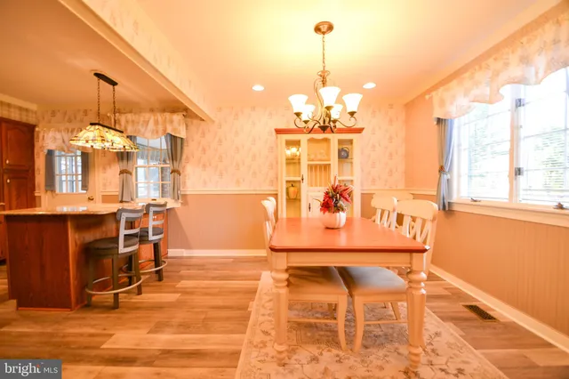a view of a livingroom with furniture and a chandelier