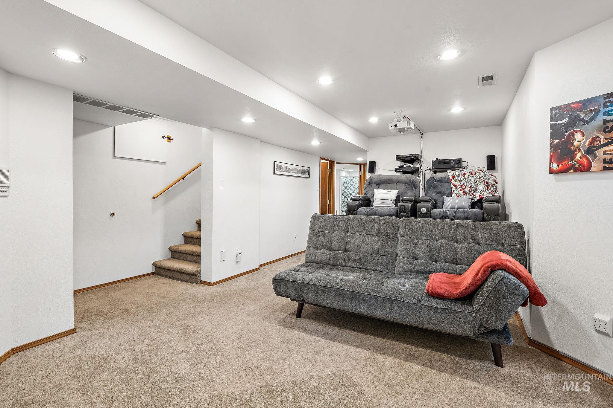 5363 North Hickory Run Place Boise, ID 83713 - Photo 35 of 50 Living area featuring recessed lighting, light carpet, and stairway