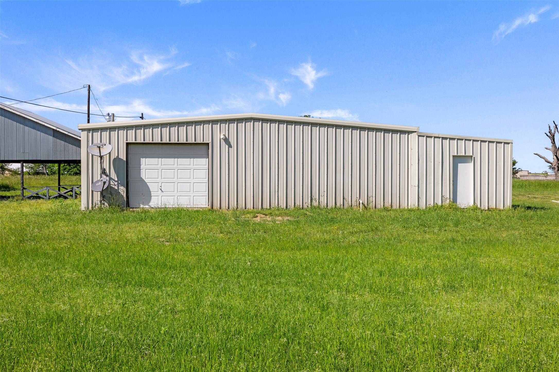 447 North Commerce Street Marquez, TX 77865 - Photo 13 of 27 a view of a backyard with a garden
