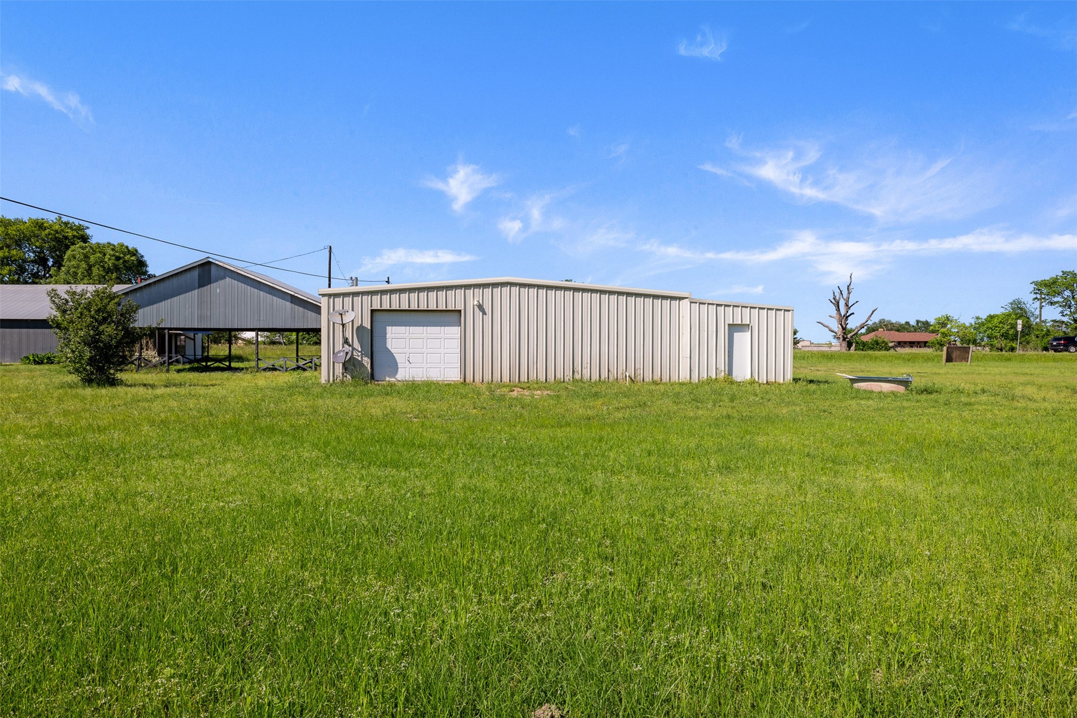 447 North Commerce Street Marquez, TX 77865 - Photo 14 of 27 a view of a house with a yard and sitting area