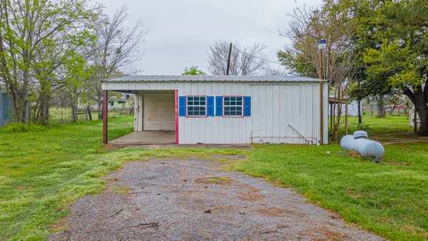 a front view of house with yard and green space