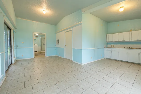 a view of a kitchen with kitchen and a sink cabinets