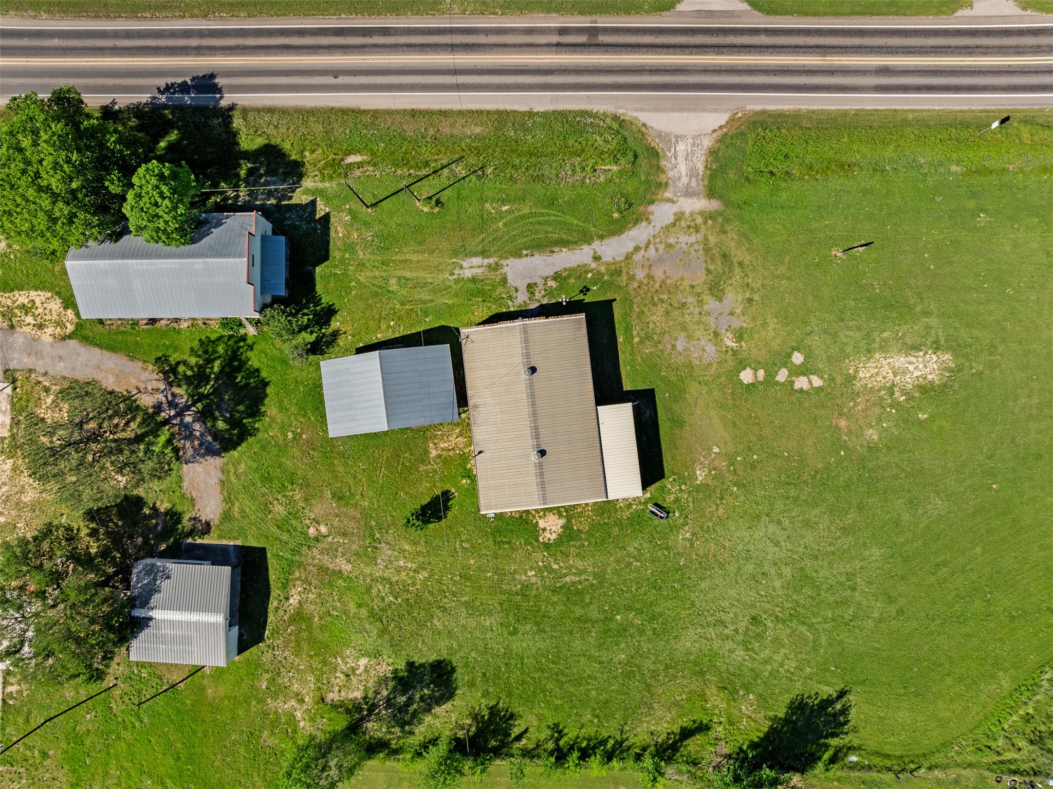 447 North Commerce Street Marquez, TX 77865 - Photo 20 of 27 an aerial view of a house with pool garden and outdoor seating