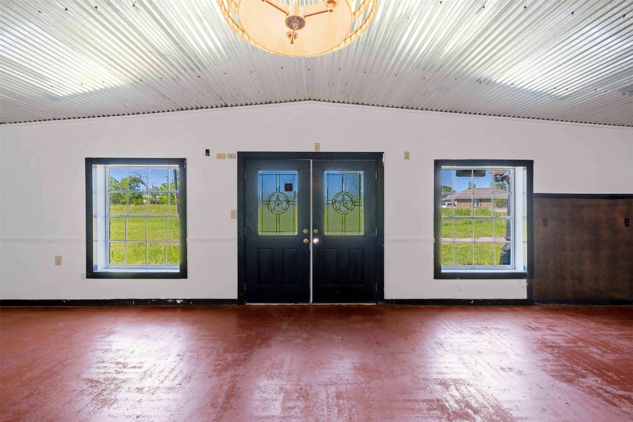447 North Commerce Street Marquez, TX 77865 - Photo 2 of 27 a view of a room with window and wooden floor
