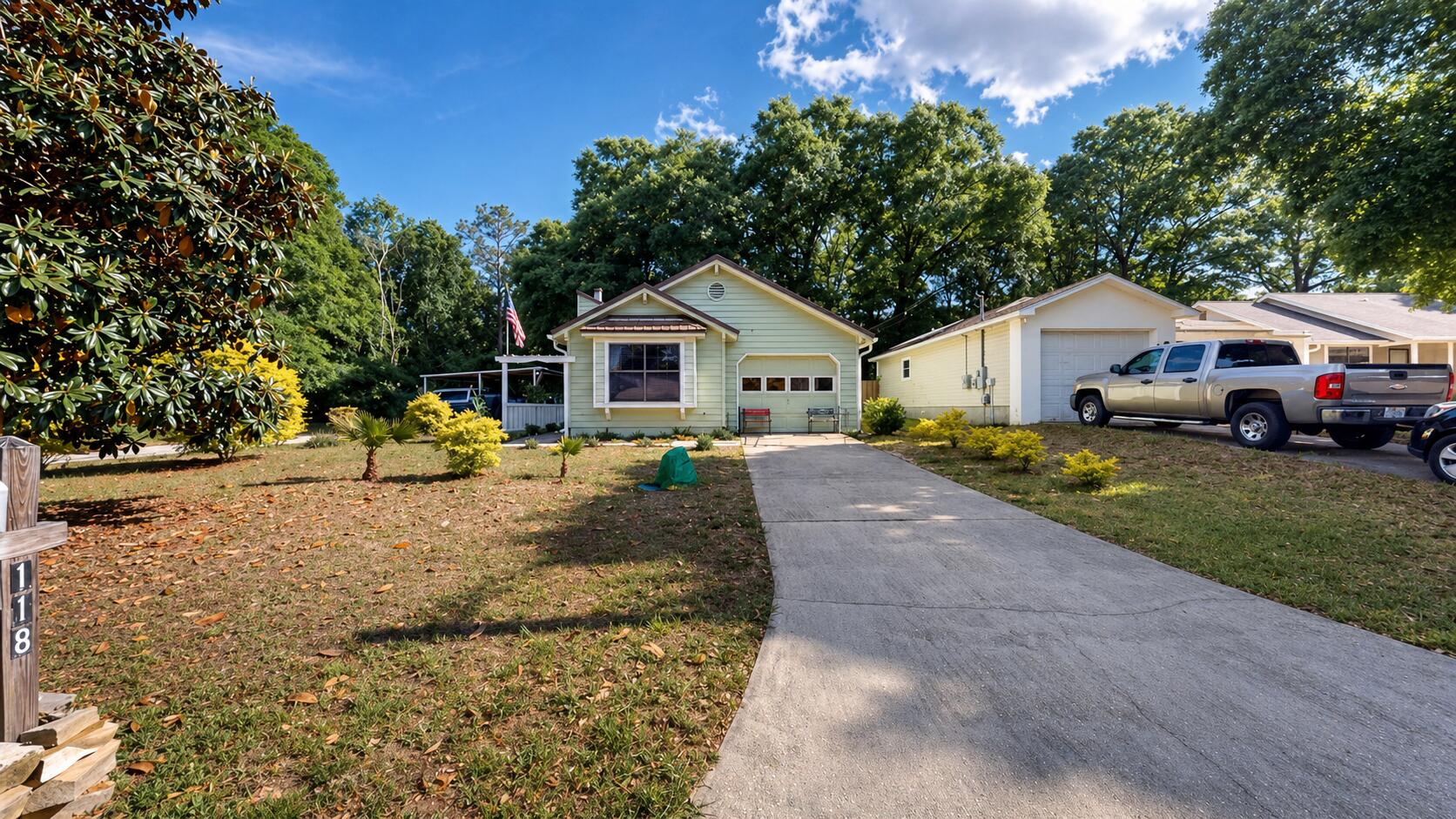 118 Fairoaks Drive Crestview, FL 32539 - Photo 1 of 23 a front view of a house with a yard and trees