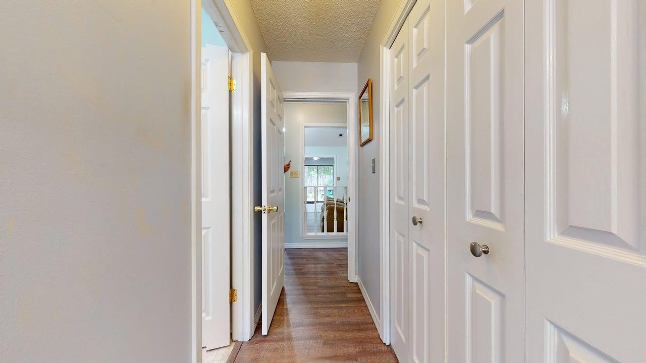 118 Fairoaks Drive Crestview, FL 32539 - Photo 14 of 23 a view of a hallway with a wooden door