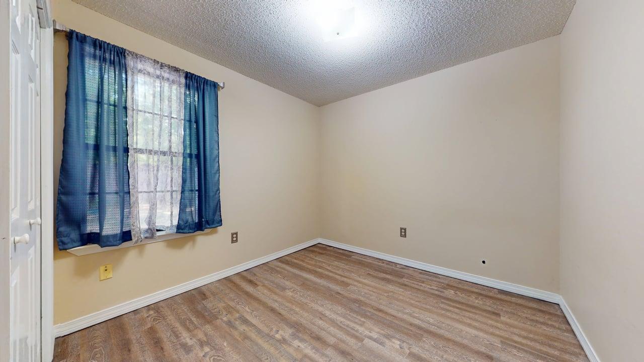 118 Fairoaks Drive Crestview, FL 32539 - Photo 15 of 23 wooden floor and window in an empty room