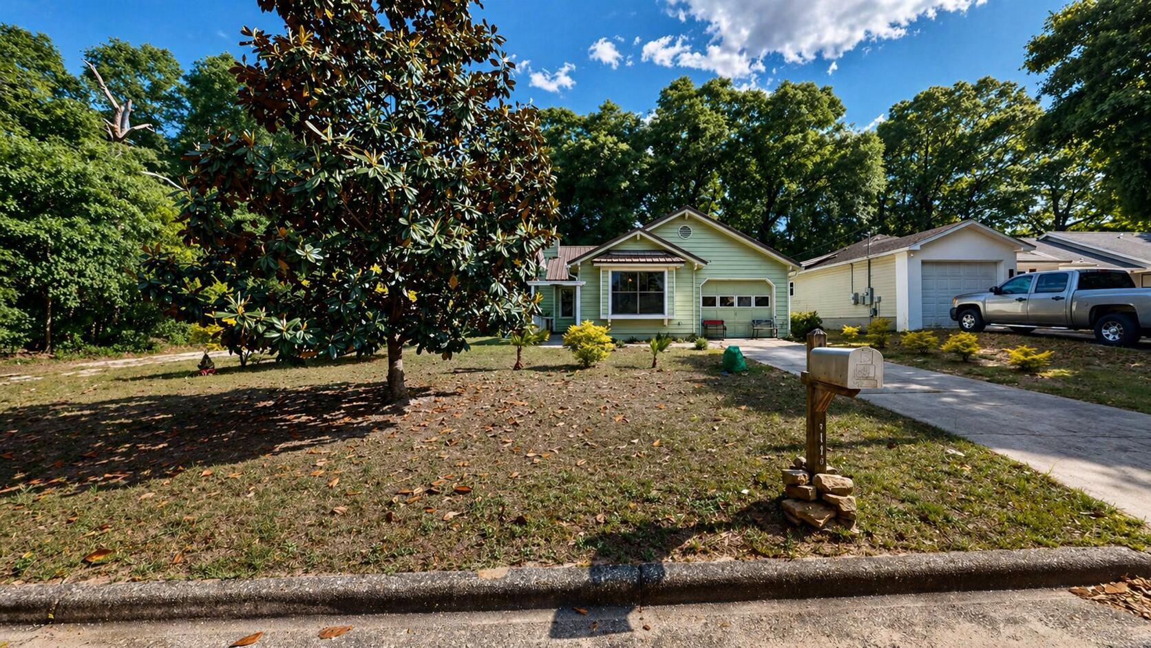 118 Fairoaks Drive Crestview, FL 32539 - Photo 22 of 23 a front view of a house with garden