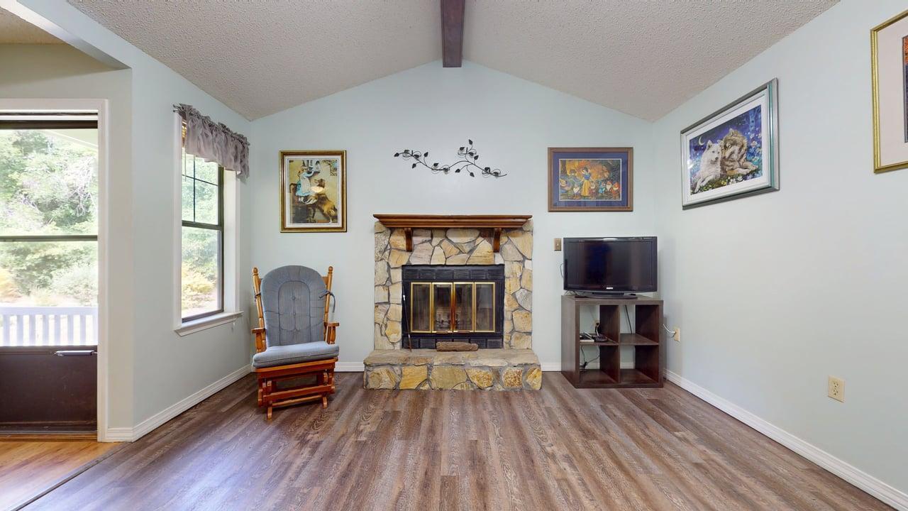 118 Fairoaks Drive Crestview, FL 32539 - Photo 5 of 23 a living room with furniture a window and a flat screen tv