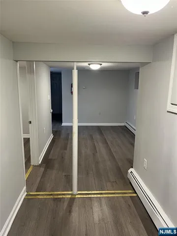 an empty room with wooden floor